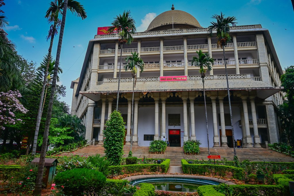 560001 pin code Bangalore General Post Office GPO building on MG Road with clock tower and red facade